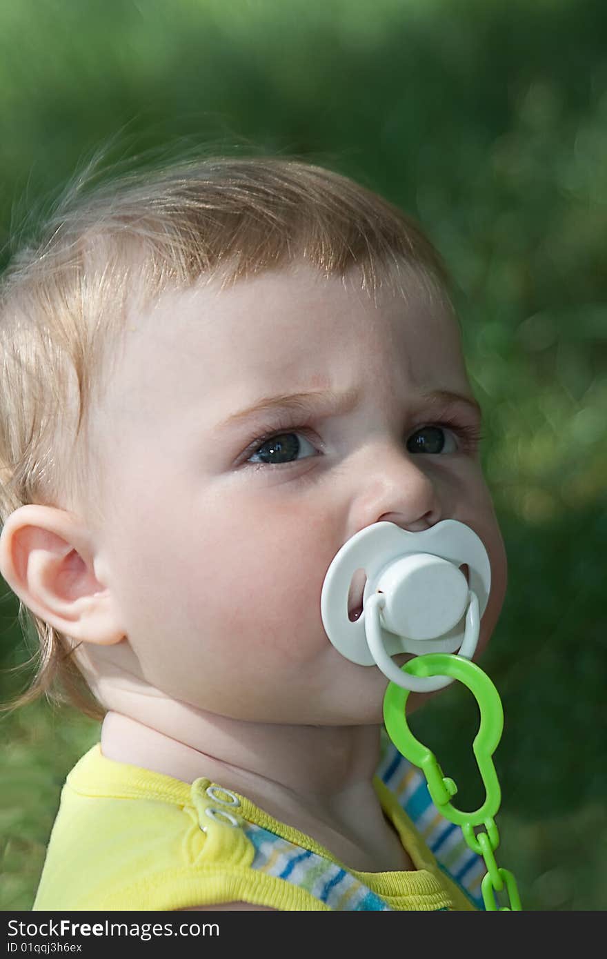 The baby on a grass. The baby on a grass