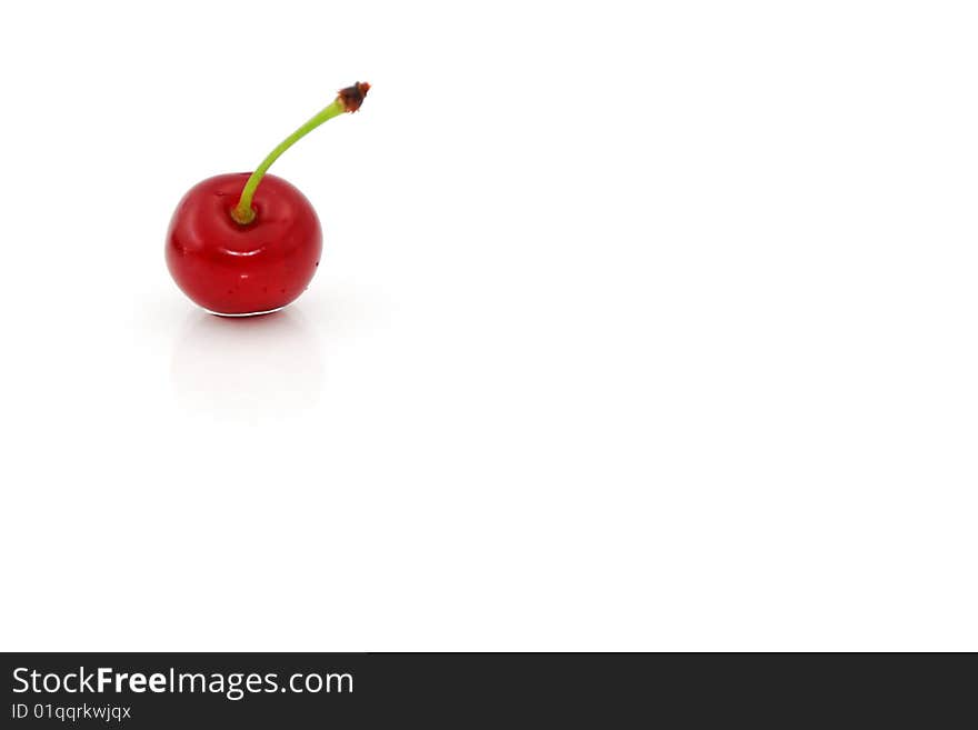 Single red cherry isolated on white. Single red cherry isolated on white