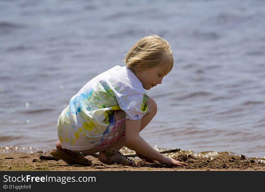 Child Playing at Beach