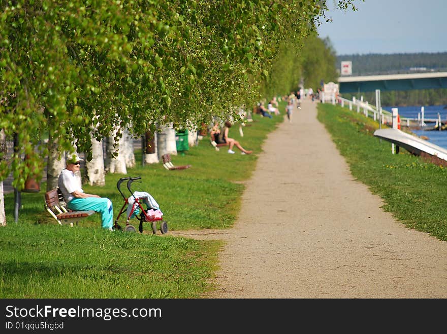 Elderly man sitting by the river