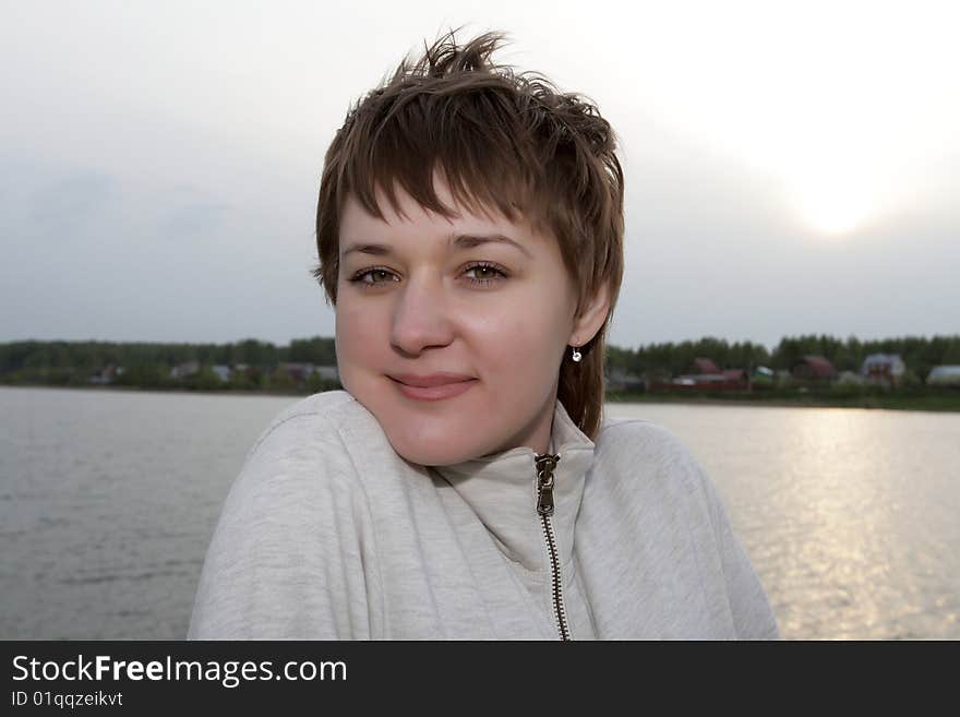 Portrait of frozen woman in Neva river background