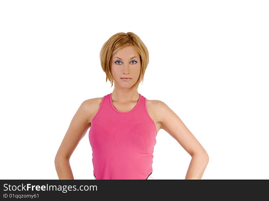 A blond female fitness instructor wearing a pink top. A blond female fitness instructor wearing a pink top.