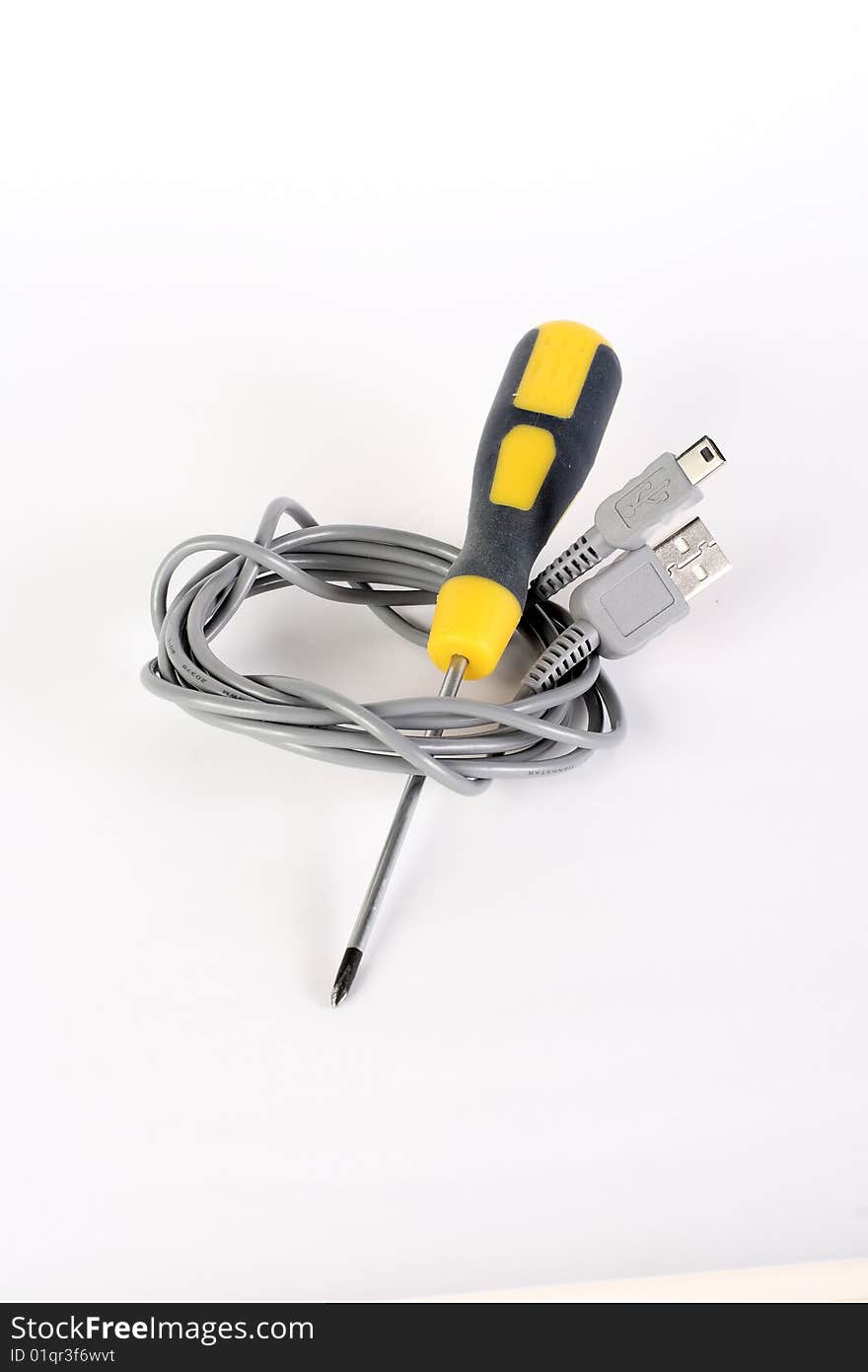 Mini USB cable with screwdriver on white background