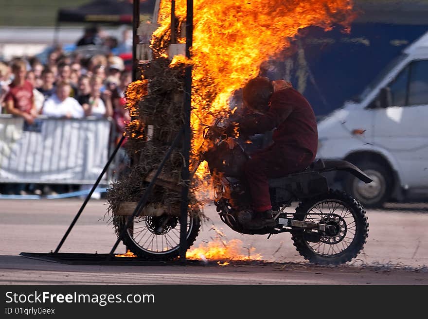 Stunt rider and wall of flames