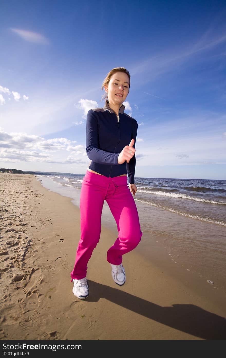 Active woman running on the beach. Active woman running on the beach