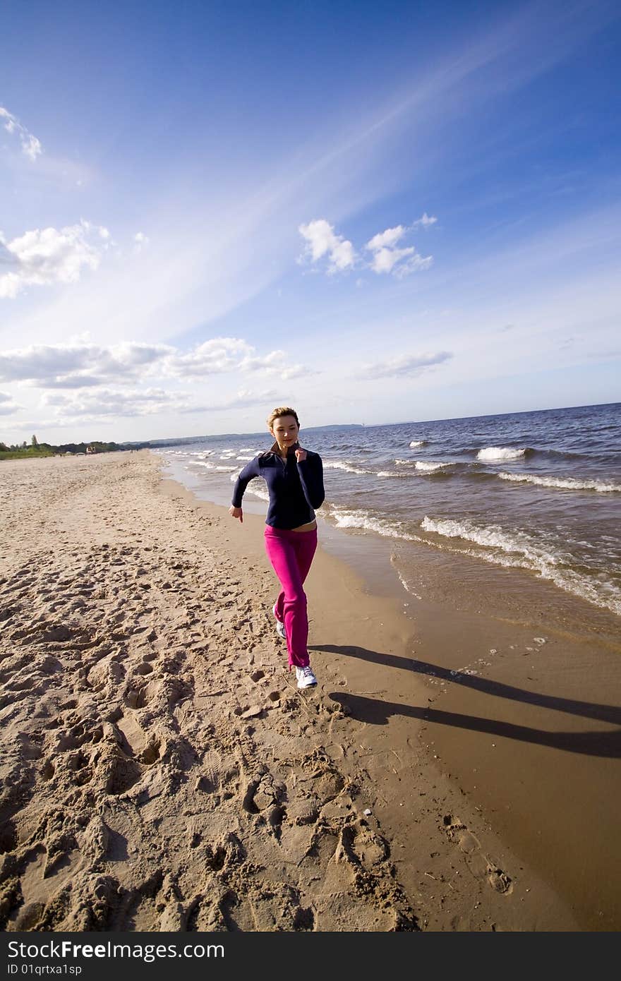 Active woman running on the beach. Active woman running on the beach