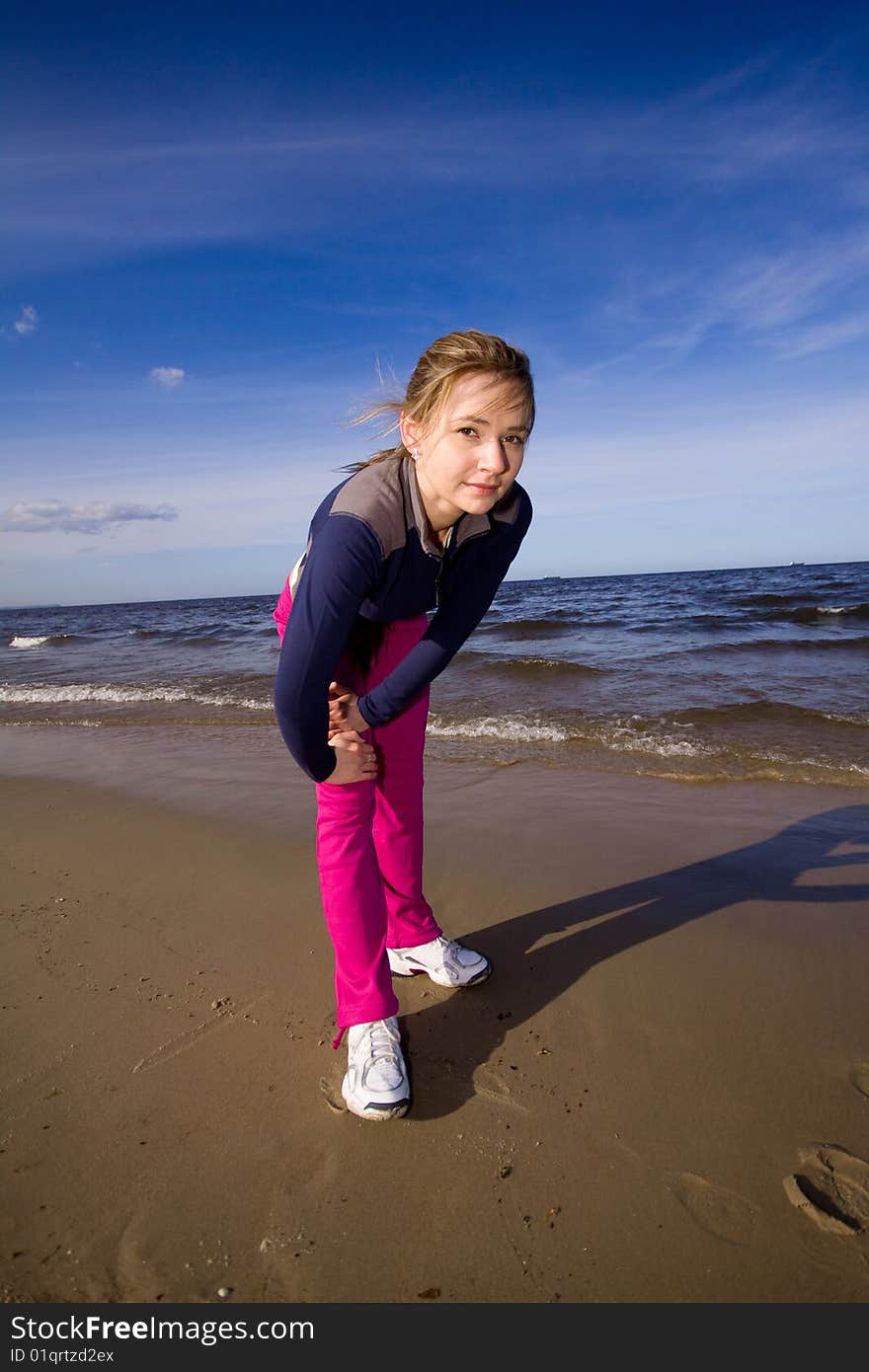 Active woman running on the beach. Active woman running on the beach