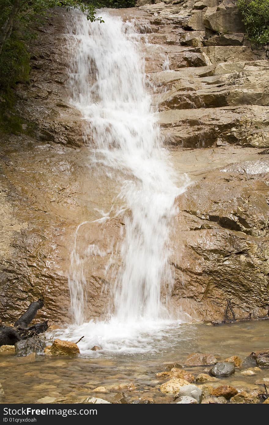 Waterfall over rocks into a small creek