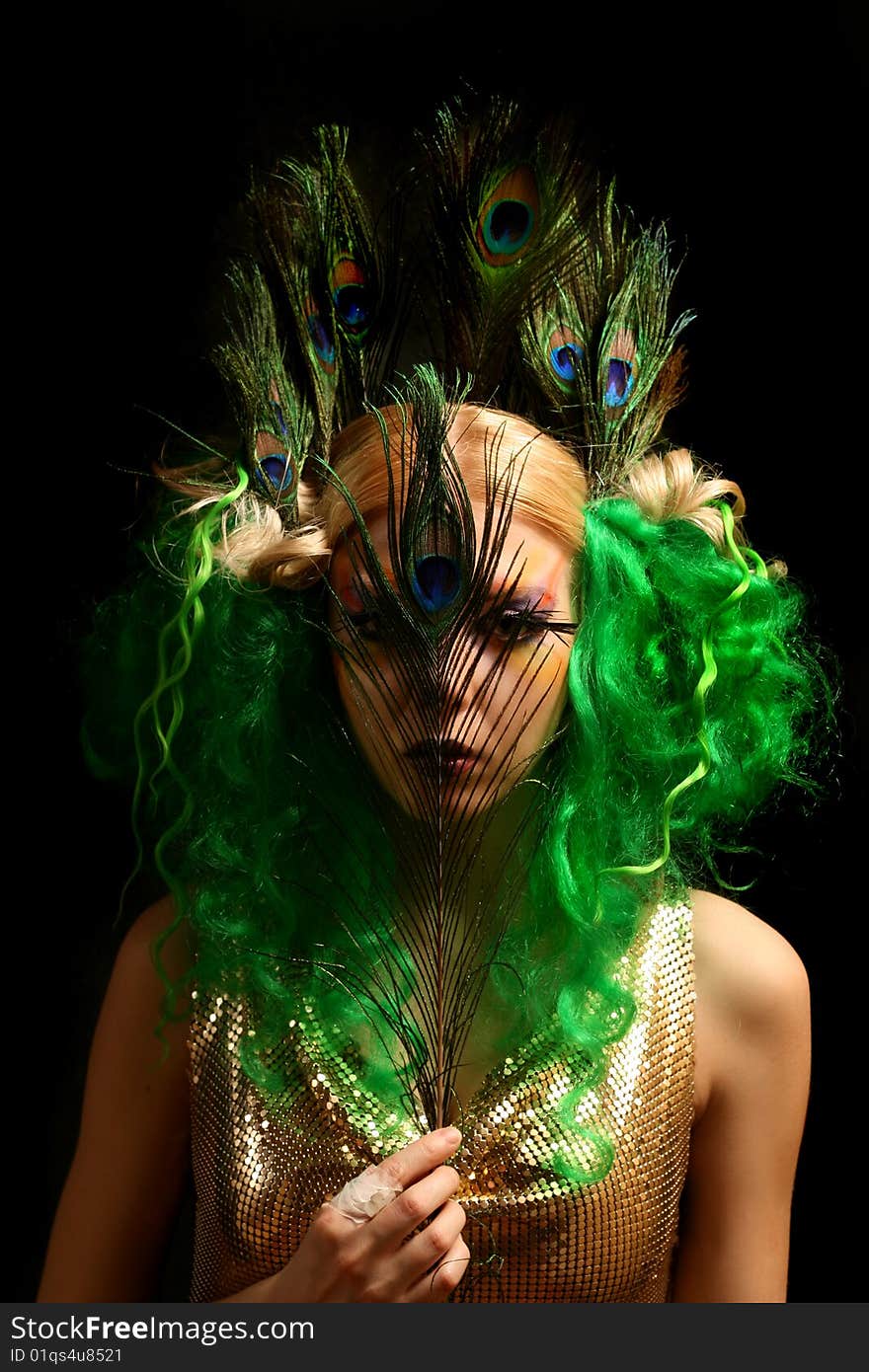 Girl-peacock in gold dress with green hairs