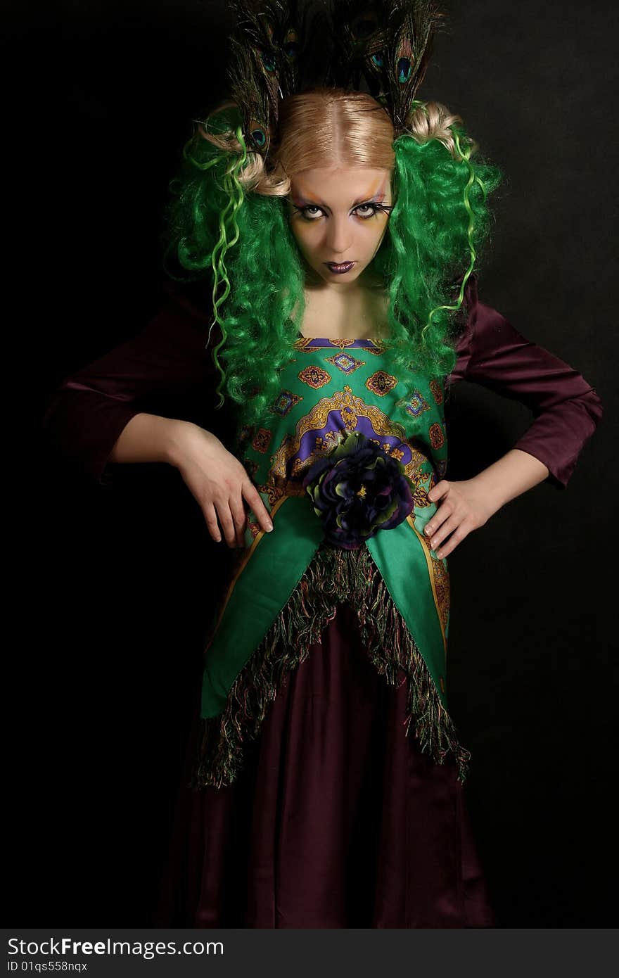 Girl-peacock with green hairs