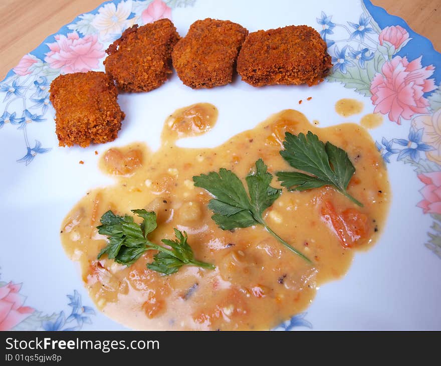 Close-up crispy beef nuggets mustard gravy picture one. Close-up crispy beef nuggets mustard gravy picture one