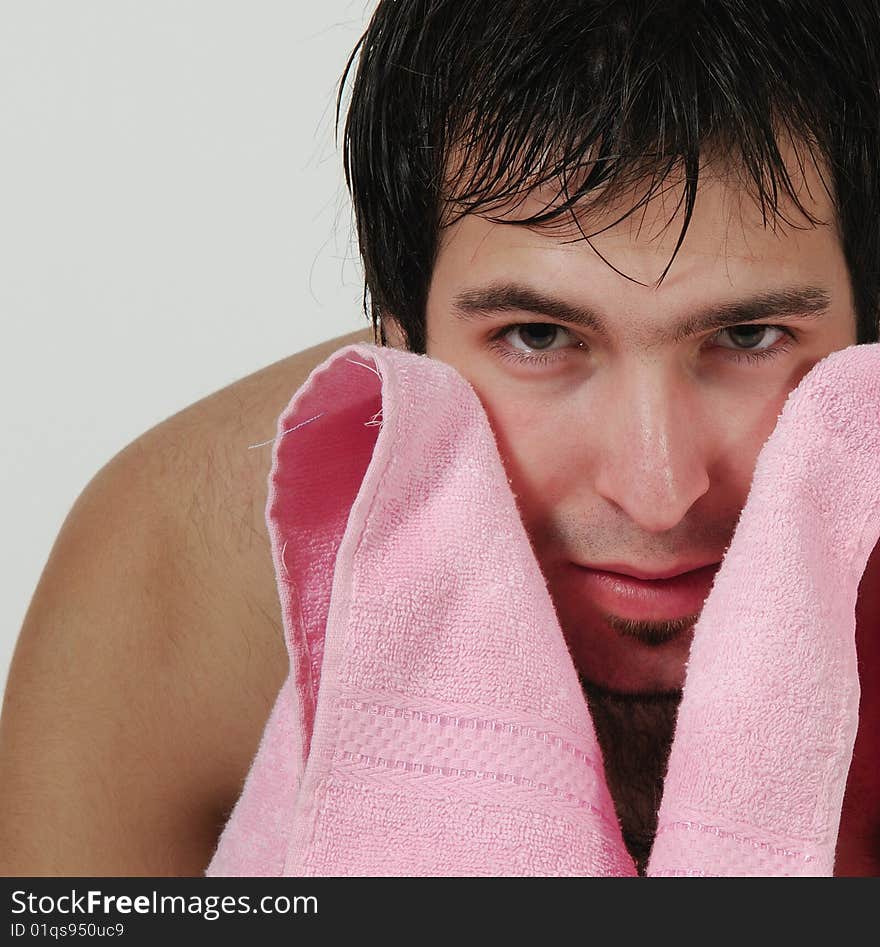 Muscular man wearing shorts and towel. Muscular man wearing shorts and towel