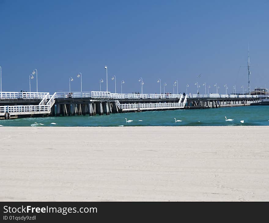 A long pier on a bright day