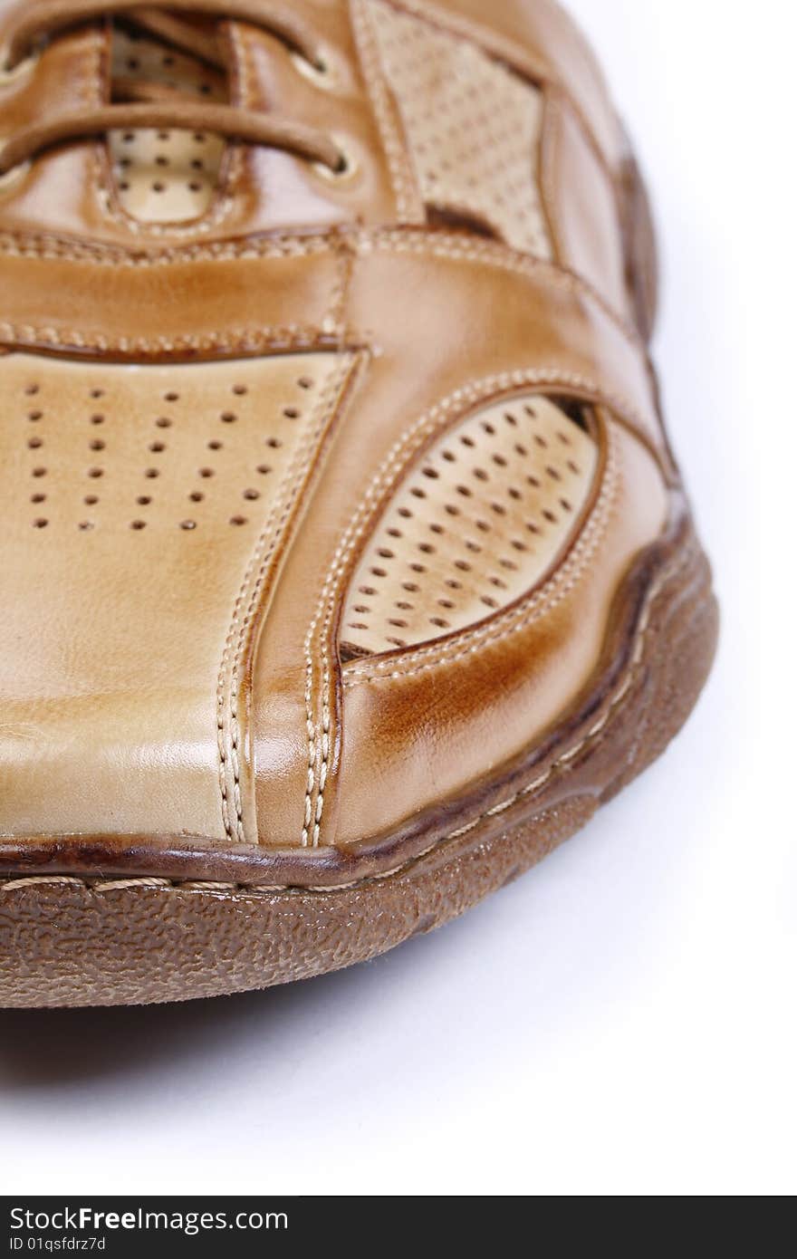 Male leather shoes isolated in white - close up