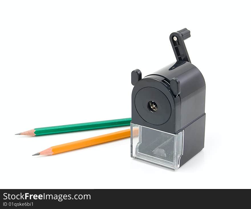 Sharpener machine and two pencils on a white background. Sharpener machine and two pencils on a white background.