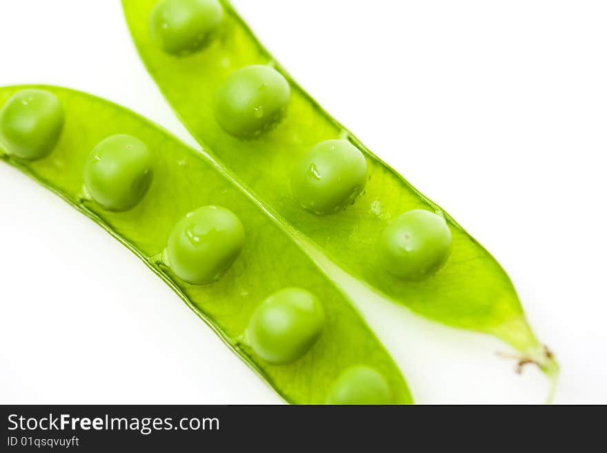 Peas in the pod isolated on white