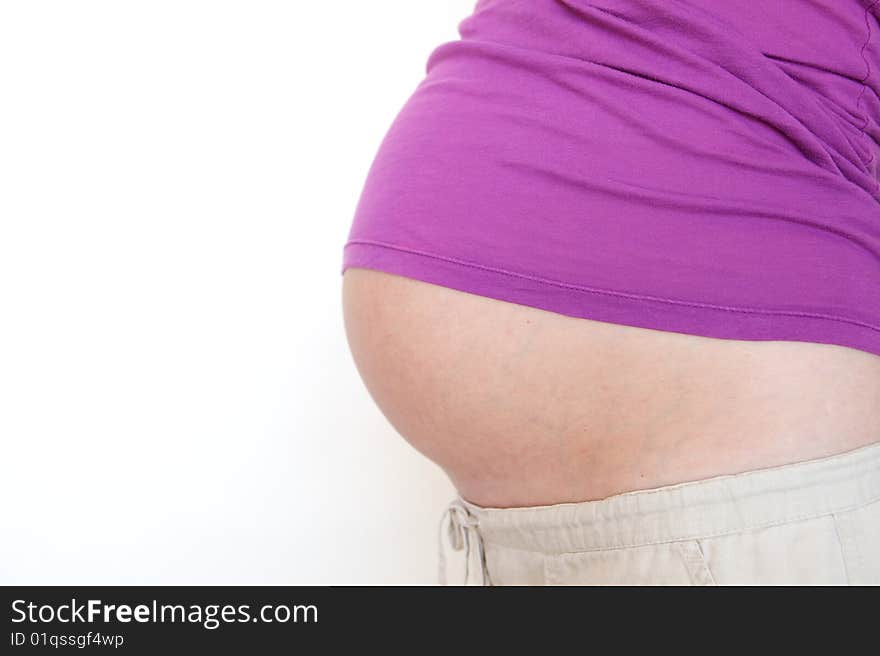 A Pregnant woman expecting a baby with a full belly