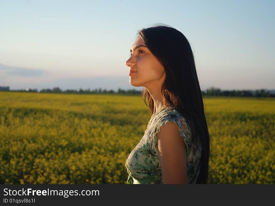 Girl On A Yellow Canola Field