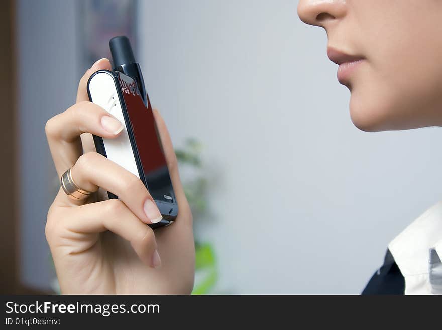 The girl speaks on a portable radio set