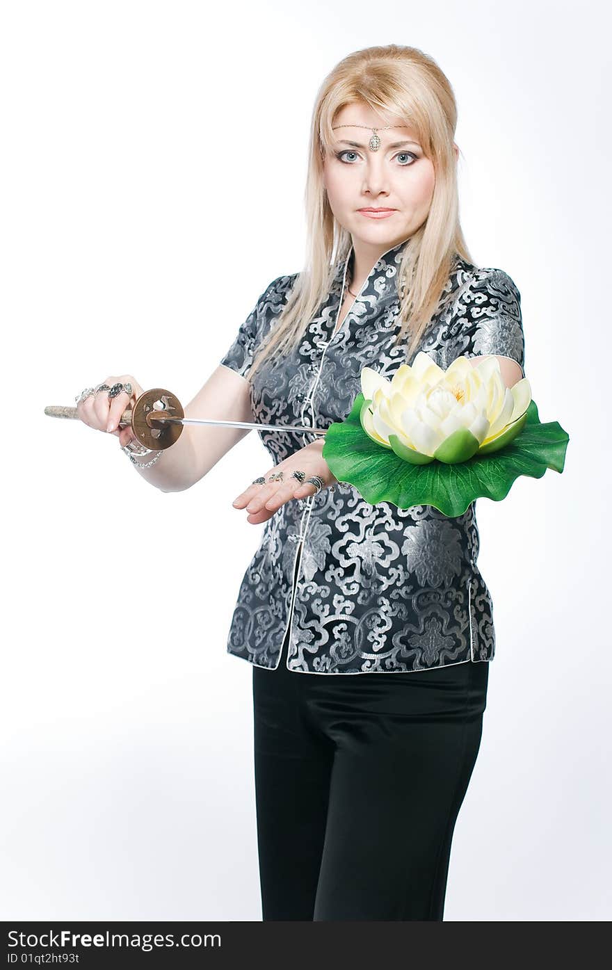 Woman with katana and lotus flower, isolated on white background