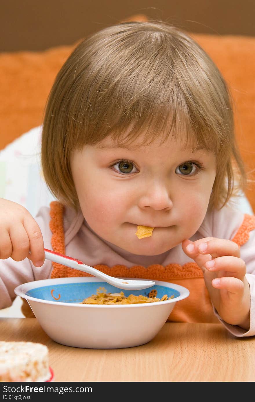 Sweet toddler baby girl eating