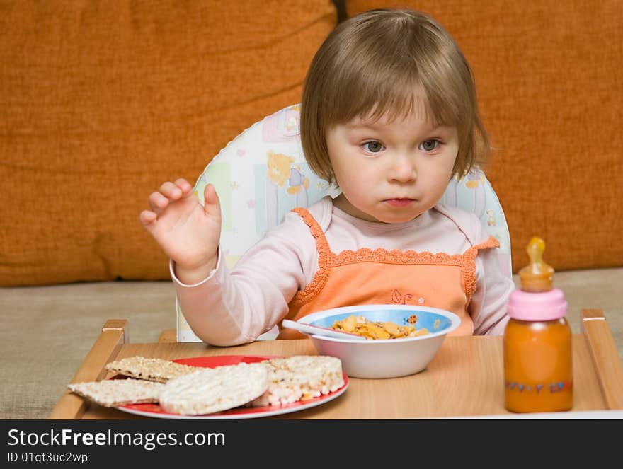 Sweet toddler baby girl eating