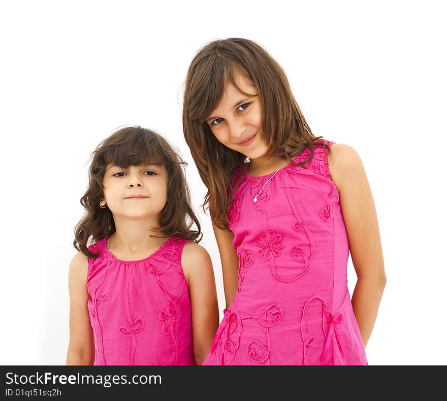 Two cute little girls posing. Two cute little girls posing