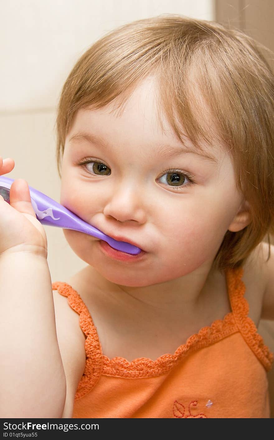 Sweet toddler baby girl cleaning teeth. Sweet toddler baby girl cleaning teeth