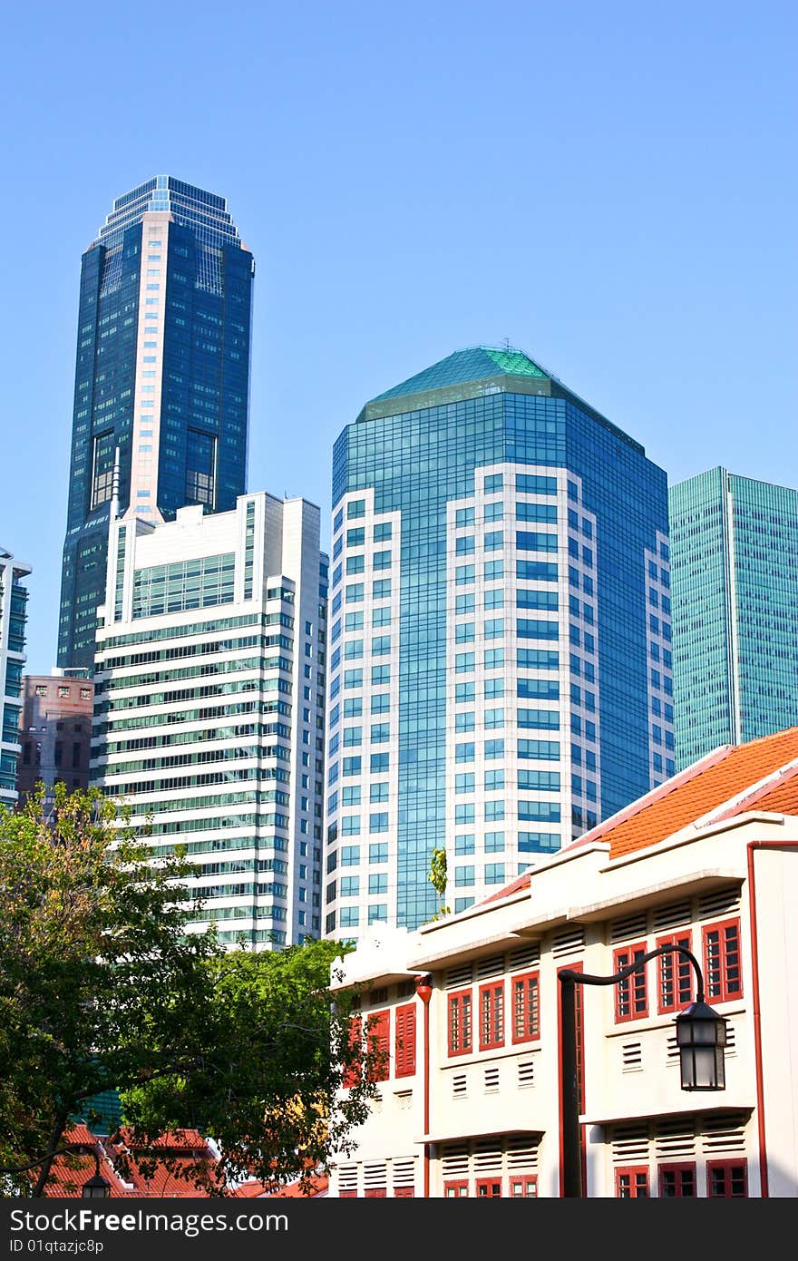 Old buildings in the foreground and modern buildings in the background. Old buildings in the foreground and modern buildings in the background