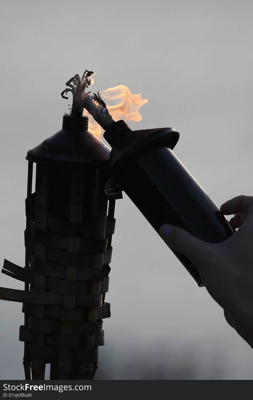 Tiki lamp being lit