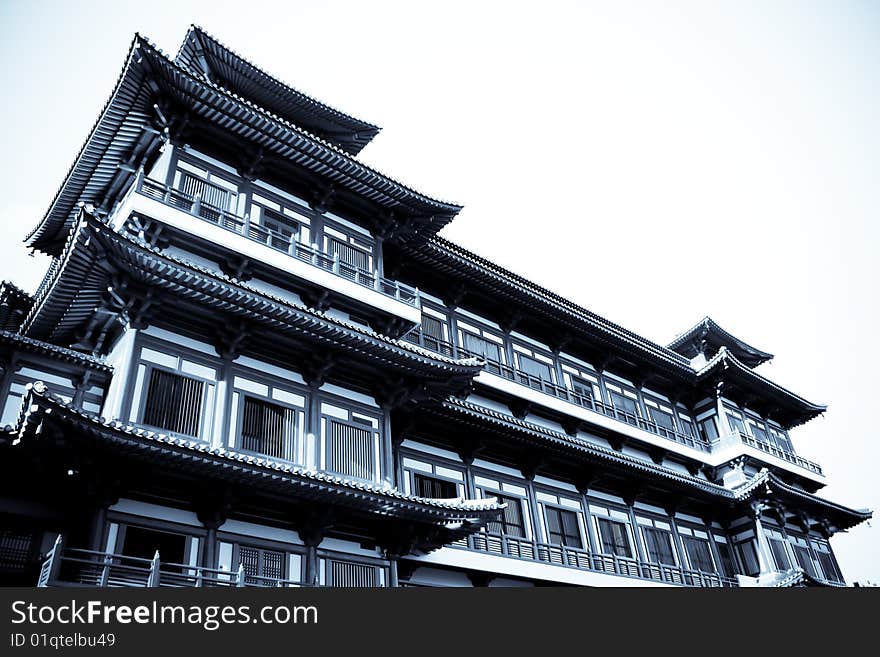 A ancient temple made out of wood in selenium tone