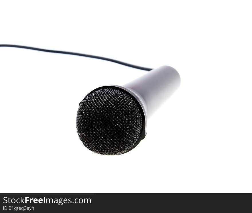 Black microphone with cable isolated over white. Black microphone with cable isolated over white