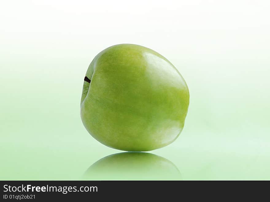 Green apple on white-green background