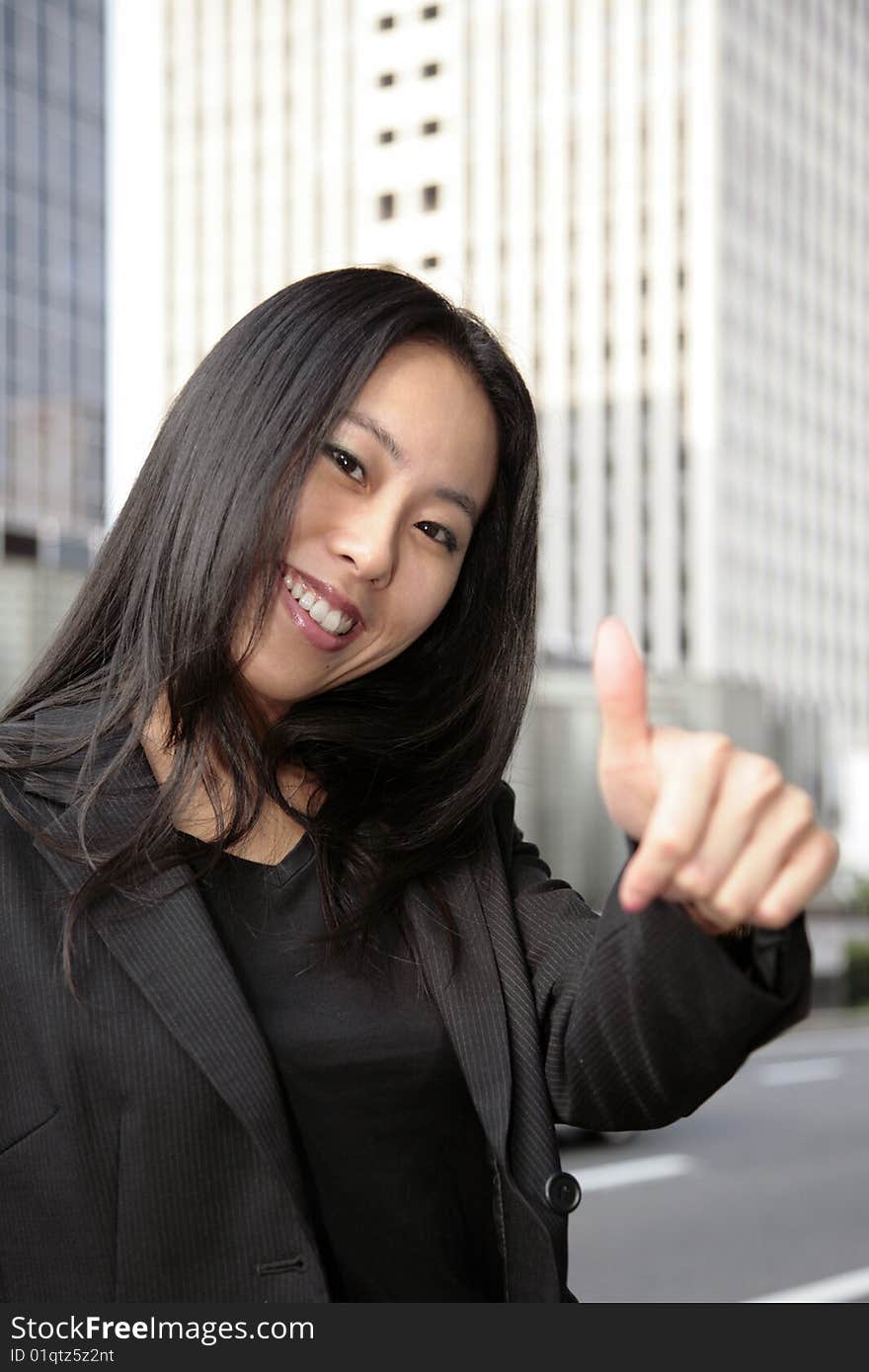 A business woman with her thumb up, more of this model in my portfolio.