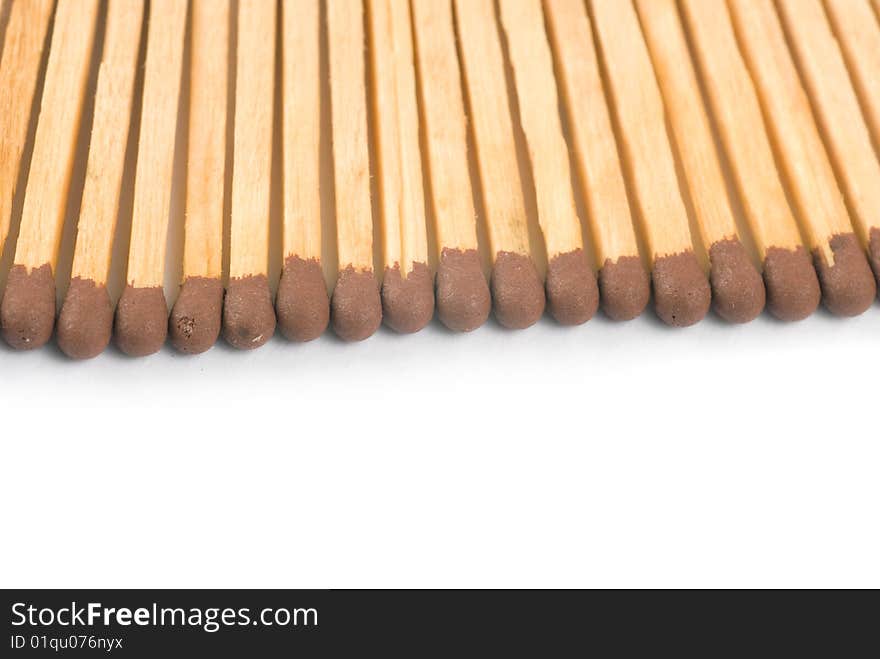 Closeup wooden matchsticks with copyspace isolated