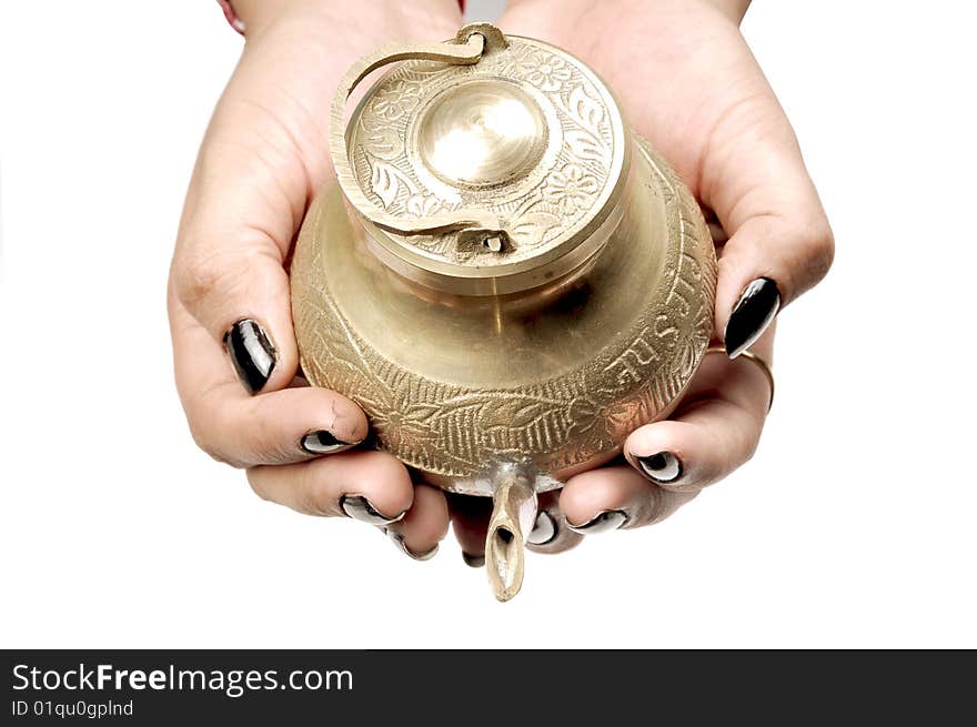 Female hands holding holy vessel on white background.