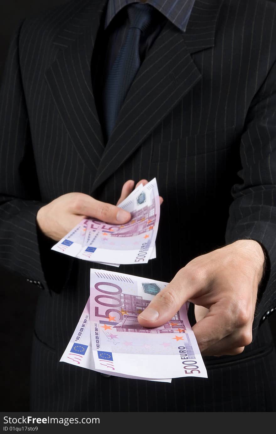 Businessman holding euros