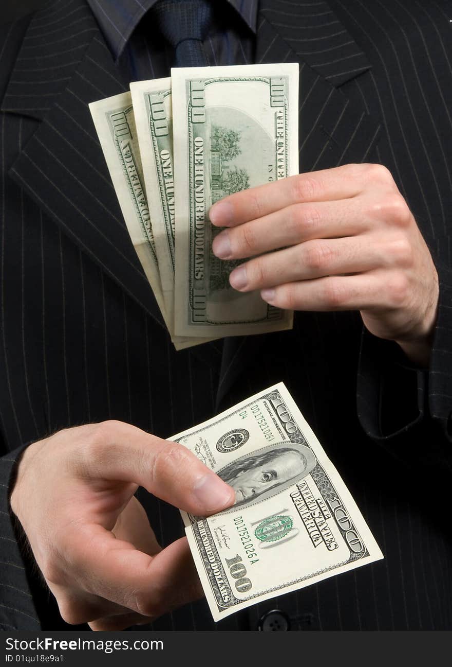 Businessman holds money in hands