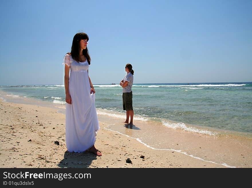 Photo of just married couple taken on the beach of Indian ocean. Photo of just married couple taken on the beach of Indian ocean