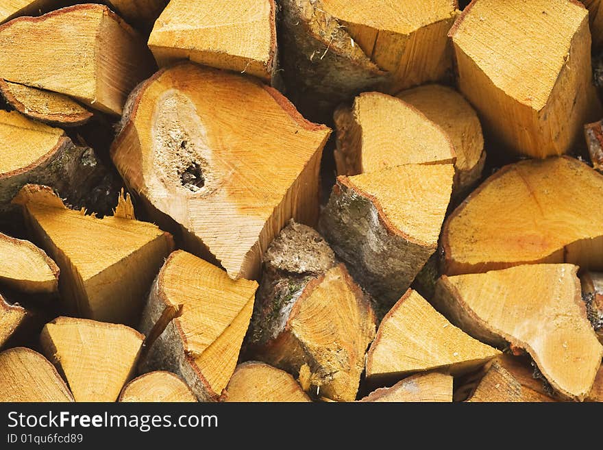 pile of cut wood for the fireplace. pile of cut wood for the fireplace