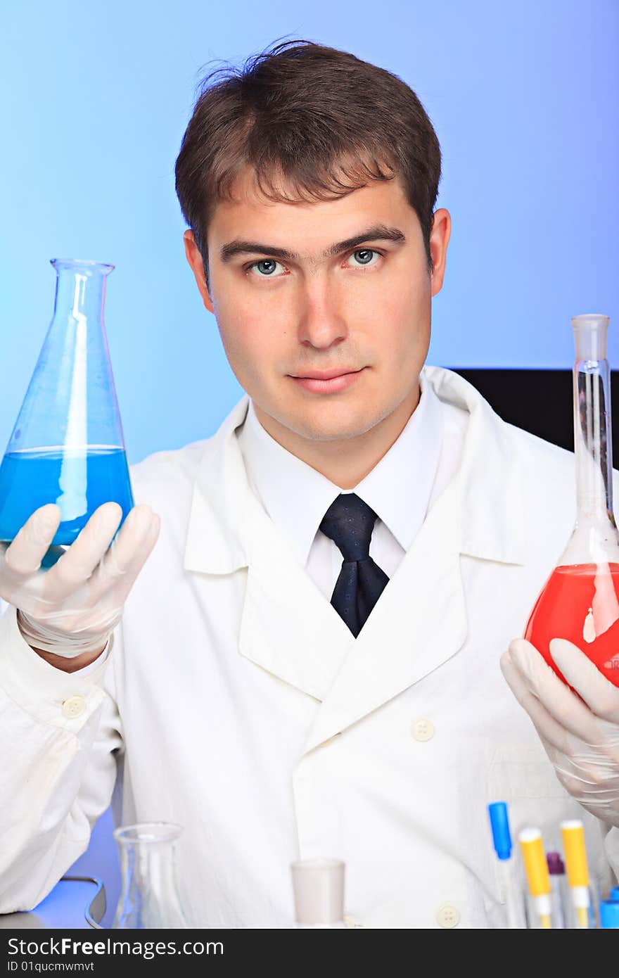 Medical theme: serious doctor working in a laboratory. Medical theme: serious doctor working in a laboratory.