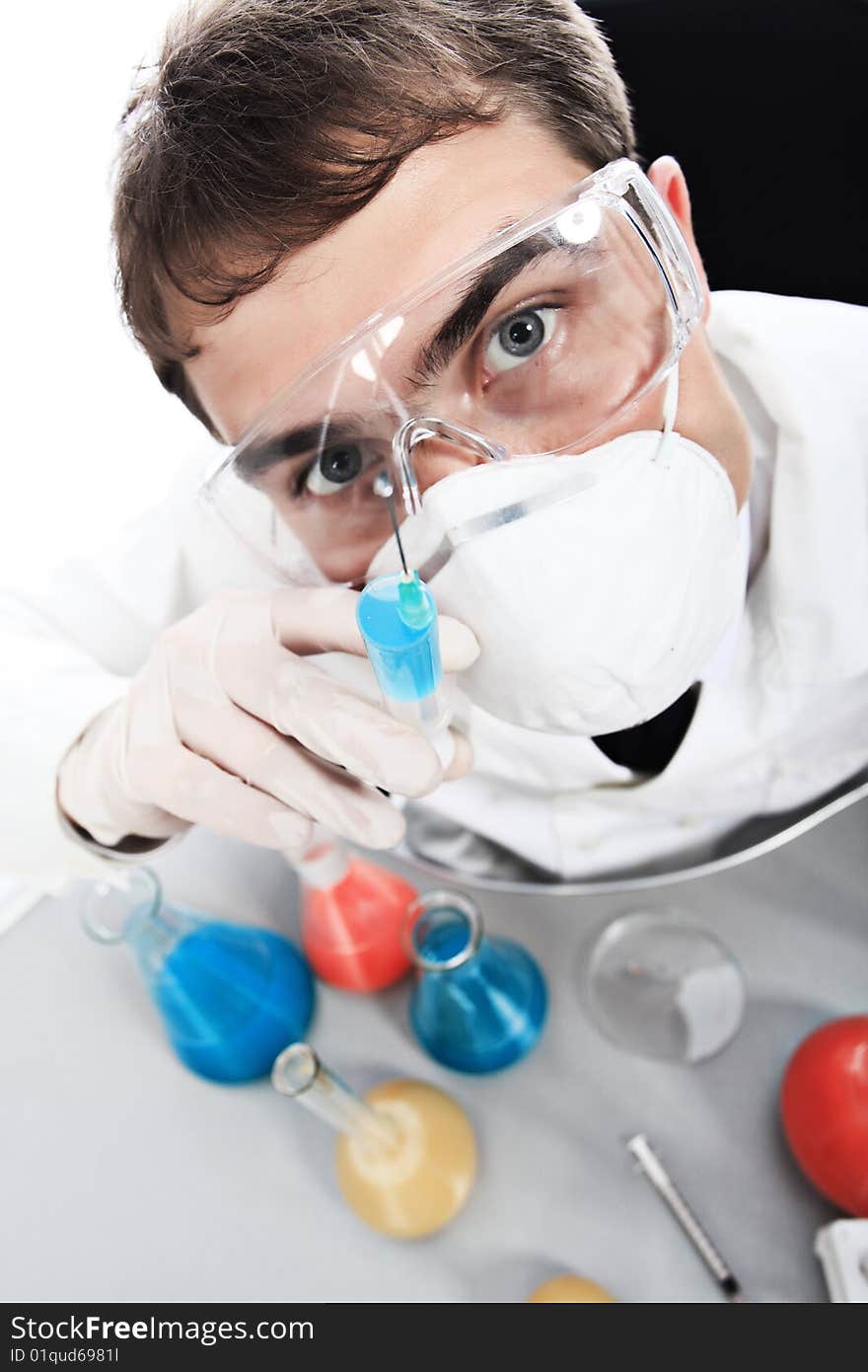 Medical theme: serious doctor working in a laboratory. Medical theme: serious doctor working in a laboratory.