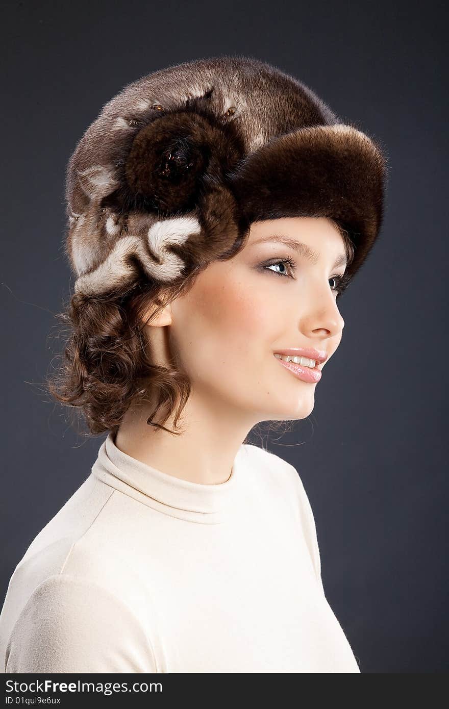 Young attractive woman in a fur hat