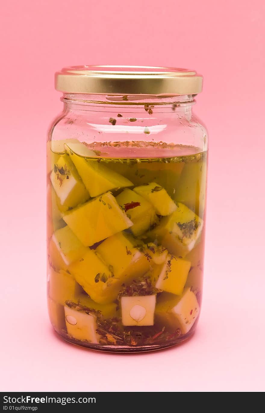 Bottle with goat cheese in olive oil
photography studio, foreground