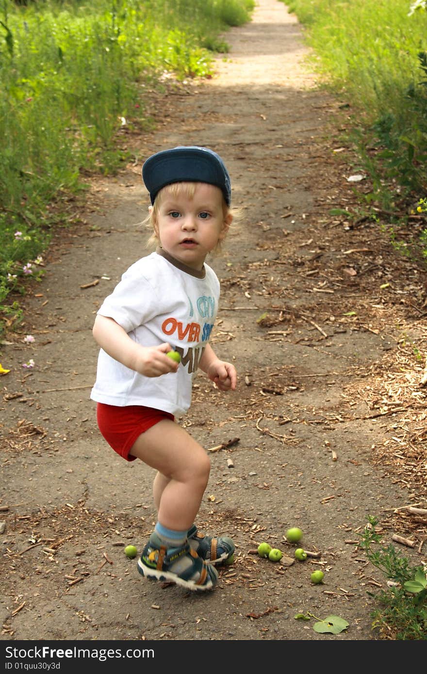 Plaing small boy in blue hat. Plaing small boy in blue hat