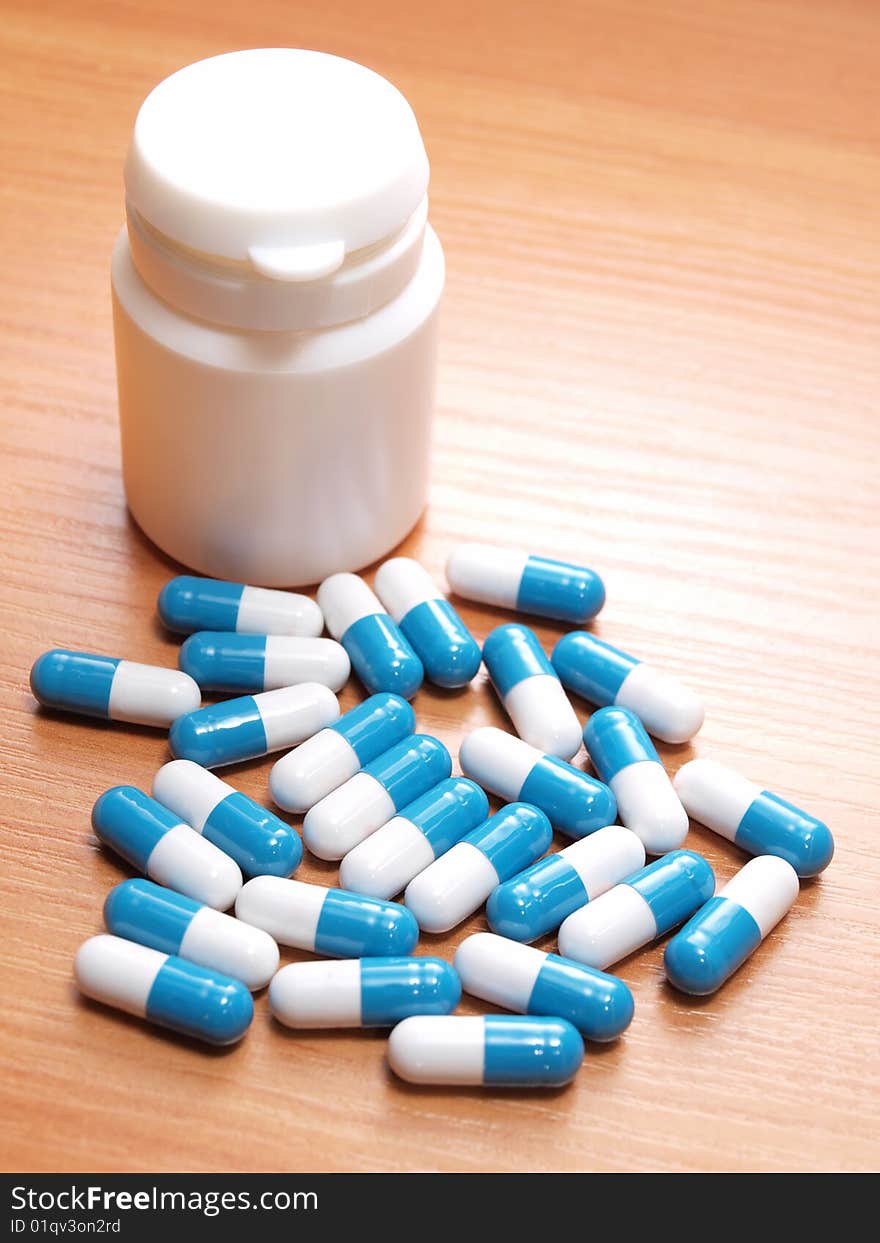 Color photograph of medical pills on the table. Color photograph of medical pills on the table