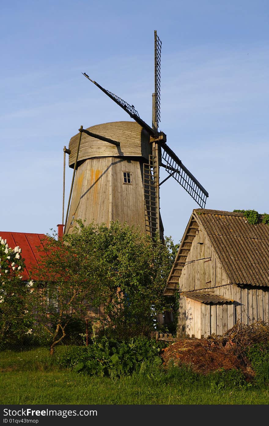 Windmill Behind Houses