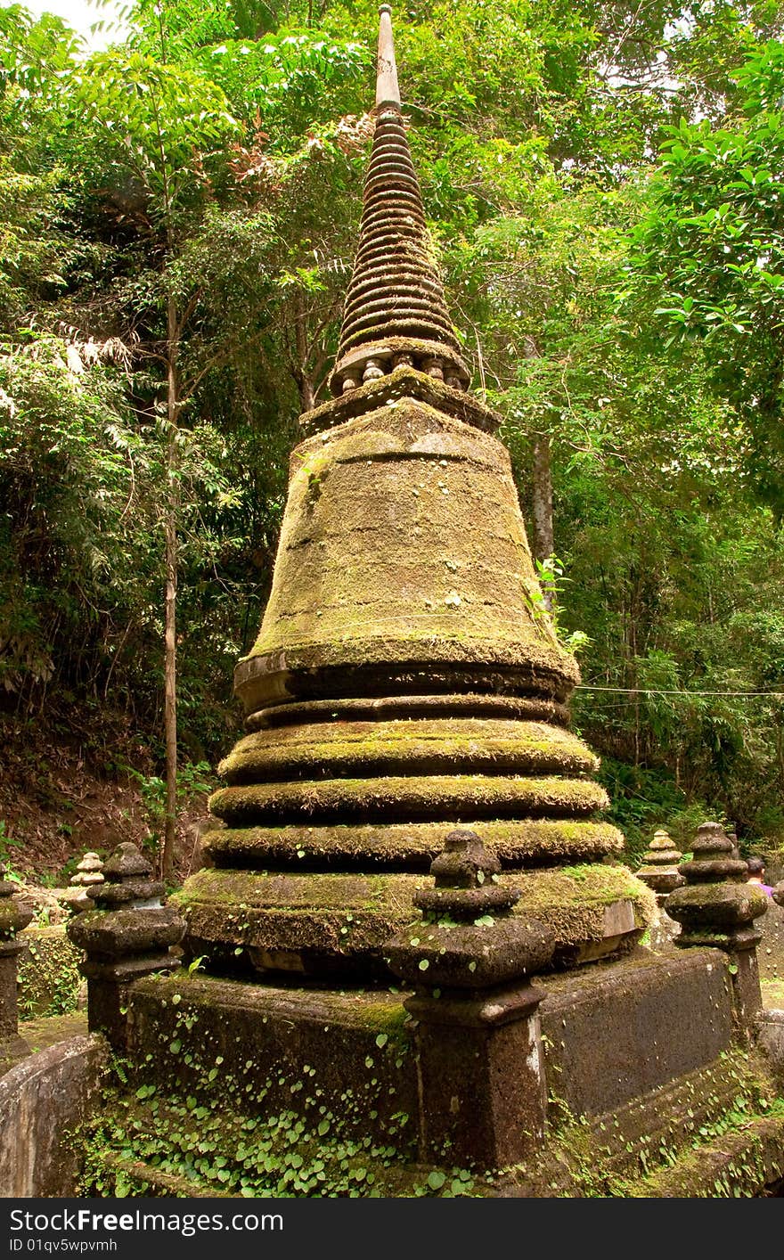 Old pagoda in forest covered with moss, taken in Plew waterfall national park, Jantaburi province, eastern Thailand. Old pagoda in forest covered with moss, taken in Plew waterfall national park, Jantaburi province, eastern Thailand