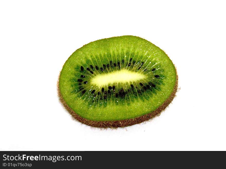 A high contrast shiny sliced kiwi