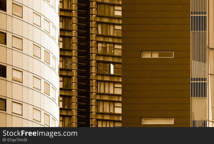 Abstract created from the juxtaposition of high rise modern buildings in close proximity in a city, rendered in sepia. Abstract created from the juxtaposition of high rise modern buildings in close proximity in a city, rendered in sepia